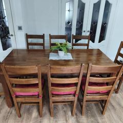 Solid wood table and 8 matching chairs