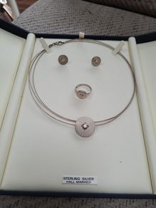 Sterling silver set of Ring, earrings and chain.