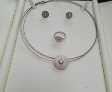 Sterling silver set of Ring, earrings and chain.