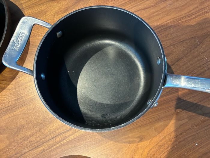 Set of All Clad pots and pans