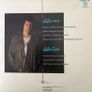 John Illsley - Never Told a Soul. Solo album by the Dire Straits bass player. Cover has the exact same photo as the Walk of Life single that would be released more than a decade later by Dire Straits and Mark Knopfler contributes to this album. Image 2