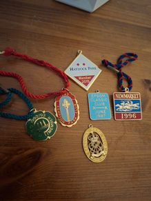 Collection of vintage horse racing member badges