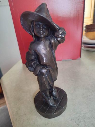 Genesis Sculpture Of A Small Girl Dressing Up With Her Moms Clothes