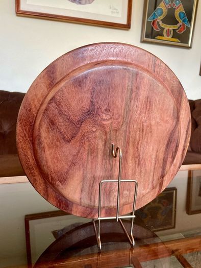 Beautiful vintage hand-carved wooden tray featuring an intricate floral border and a decorative brass inlay geometric star motif in the centre. The craftsmanship is detailed and very tactile, giving this piece a rich, warm character. The tray is solid and