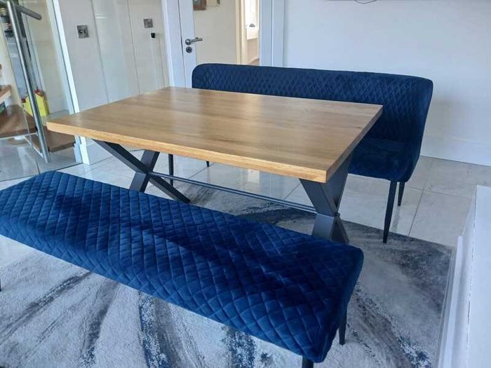 Dining table with two blue velvet benches