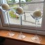 Set of 3 clear glass stemmed candle holders with ivory candles Image 4