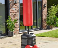 Punch bag with boxing gloves