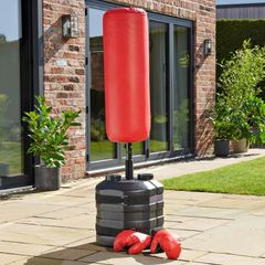 Punch bag with boxing gloves