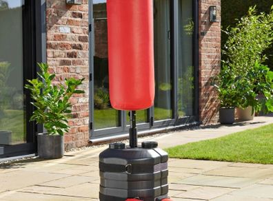 Punch bag with boxing gloves