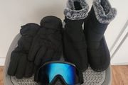 Woman ski boots gloves and glasses