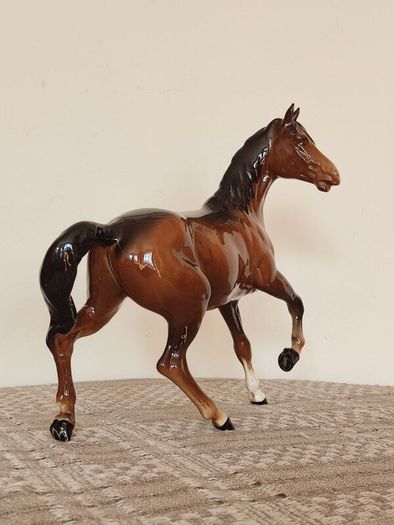 Vintage Royal Doultot porcelain horse. new in the box.