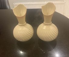 Pair of Beleek Irish Parian wear based   with a pale pink trim
