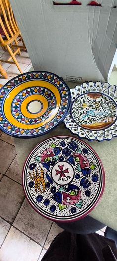 3 hanging wall plates -1- from Malta hand painted -2- from PORTGAL HAND PAINTED-3- FROM MAROCO - EACH IS 22.00 Euro.