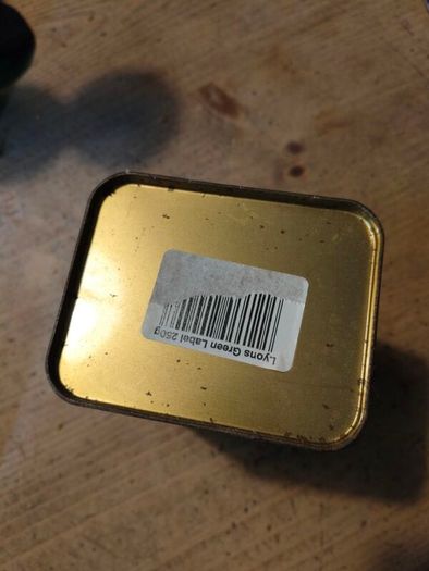 This vintage Lyons Green Label tea tin is a collectible item.