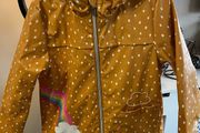 Girls  Rainbow Print Fleece Lined Rubber Jacket Age 6-7 years