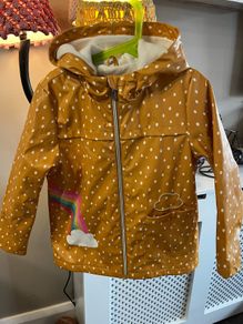 Girls  Rainbow Print Fleece Lined Rubber Jacket Age 6-7 years