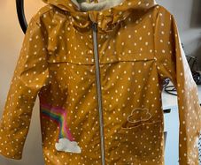Girls  Rainbow Print Fleece Lined Rubber Jacket Age 6-7 years