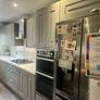 grey shaker Kitchen Units, white spec worktops, gas hob with glass extractor and FRANKE sink included. Image 3