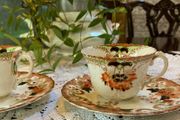 2 vintage cups with plates