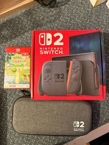 Nintendo Switch 2, 1 day old with Pokemon Pokopia and carry case