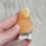 orange calcite parrot carving Image 4
