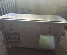 An old antique centre table with marble taps