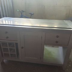 An old antique centre table with marble taps
