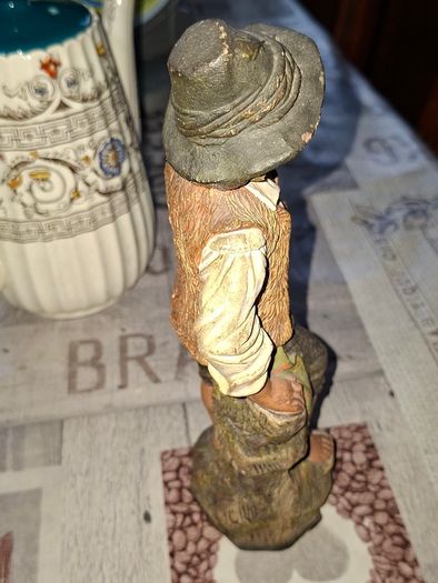 Old Painted Terracotta of a Young Country Boy Holding a Flute, standing on a rocky base. It resembles late 19th- or early 20th-century European decorative sculptures, such as pieces produced by makers like Goldscheider