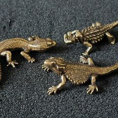 3 brass lizards.
