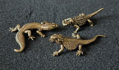 3 brass lizards.