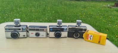 Four Kodak instamatic cameras