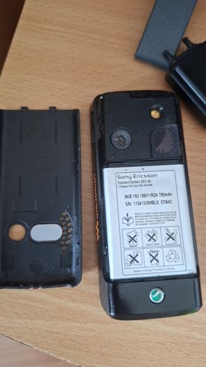 Sony Ericsson W200i , with charger and speakers.
