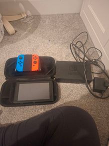 Nintendo switch, case, docking station, controller and optional 2 games
