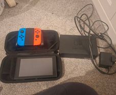 Nintendo switch, case, docking station, controller and optional 2 games