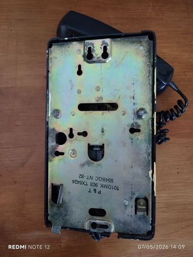 Wall Mounted P&T Black phone.