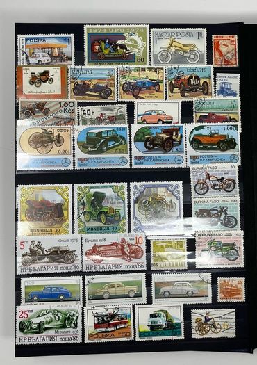 Ace Black 32 page/ 16 leaf Stamp Album with over 900 stamps. Thematic of Animals, Plants, Classic Cars, Space, Trains, Sport & Disney noted.