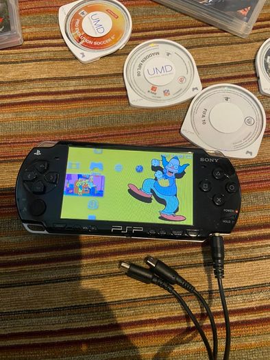 PSP  Console plus 10 games, charger and headphones
