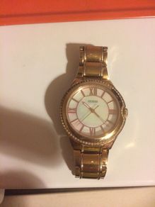 Orginal ladies gold guess watch post available