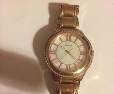 Orginal ladies gold guess watch post available