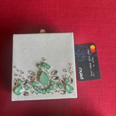 embellished bag with green stones