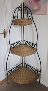 Wrought iron and wicker corner shelf unit