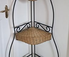 Wrought iron and wicker corner shelf unit