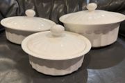 3 white serving bowls with lids.