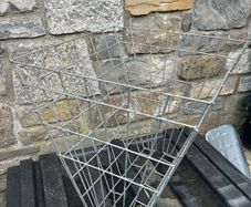 Double sided hay racks and double bucket holder