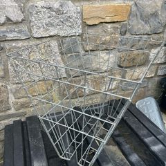 Double sided hay racks and double bucket holder