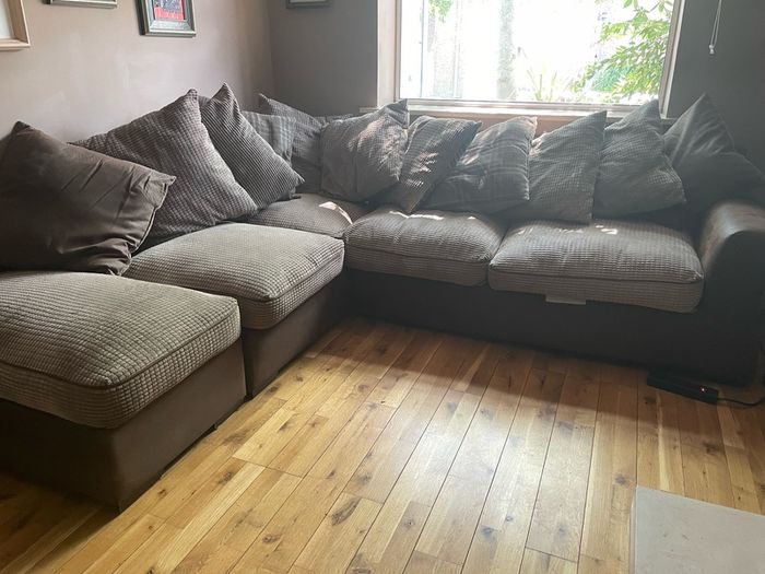 L shaped couch with poof