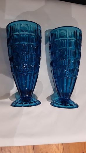 A pair of blue/deep turquoise glass vases