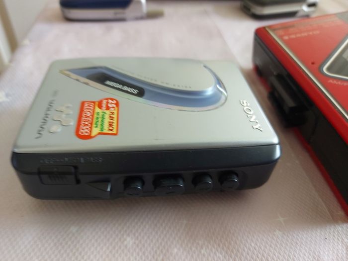Sony Walkman and Sanyo AM-FM Stereo cassette Player, excellent cosmetic condition, no cables or batteries