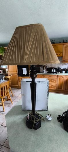 Vintage ebonized table lamp featuring an octagonal base, likely dating from the early 20th century.