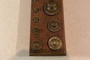 Antique brass weights in original wooden stands